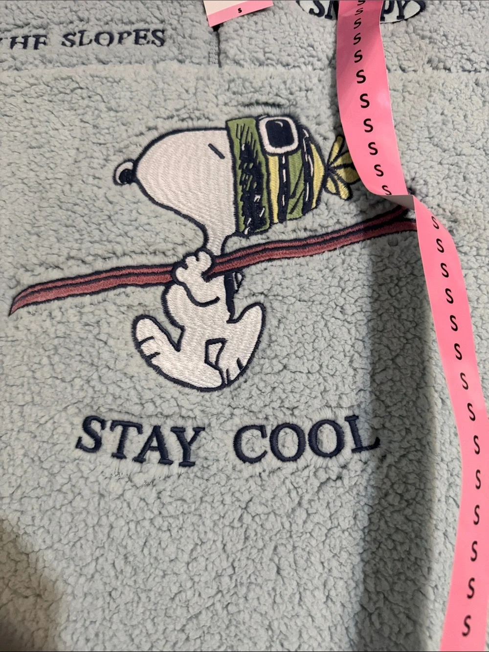 Peanuts Light Blue Sherpa Pullover with Navy Collar and Snoopy Ski Graphic